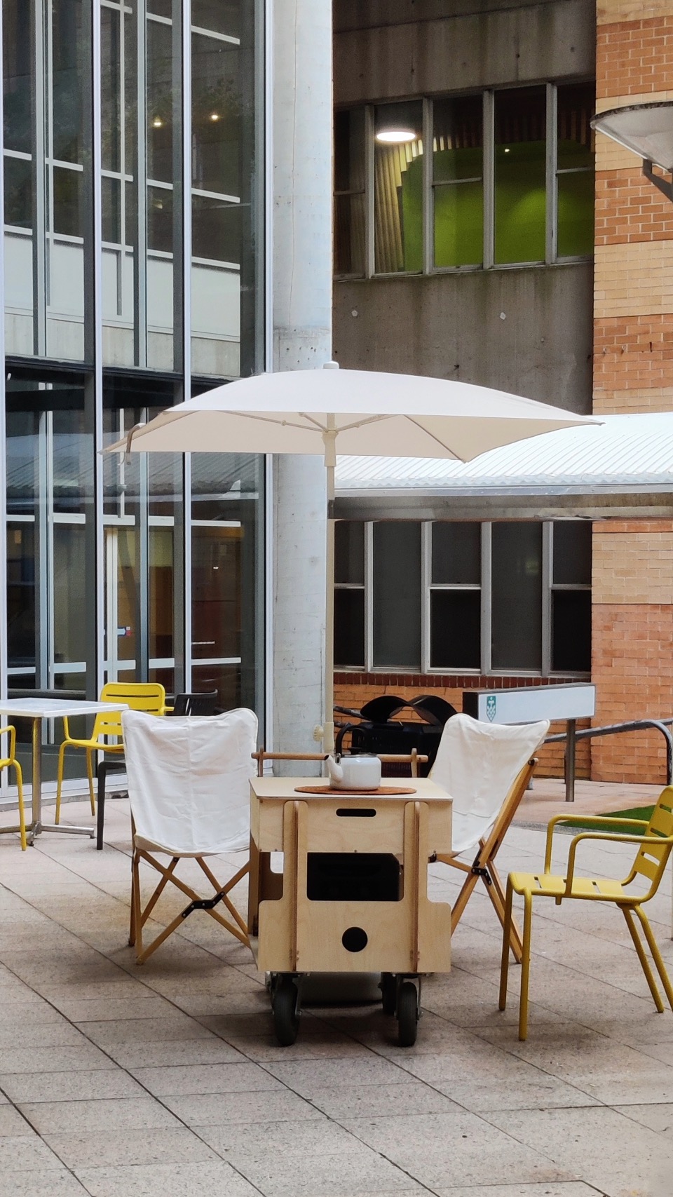 The Hearth in a courtyard surrounded by workplace architecture
